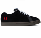 A black suede low-top sneaker with white laces, a dark gray sole, and a red '23' printed on the heel, shown in a side profile on a white background.