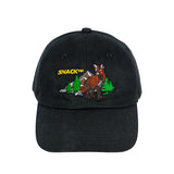 Black cap with embroidered design of a fox and trees on a white background