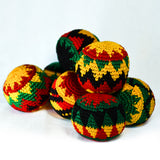 Ace Hacky Sack | Ace - Pile of knitted hacky sacks in red, green, black, and yellow Rasta-inspired patterns.