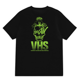 Deathwish Death TV VHS Pocket Tee: Black t-shirt with neon green skull, MTV eye, target eye, mushroom cloud, and VHS text.